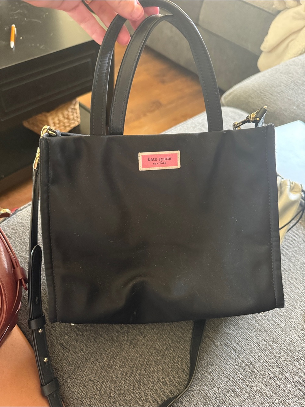 kate spade black nylon satchel with pink logo plaque
